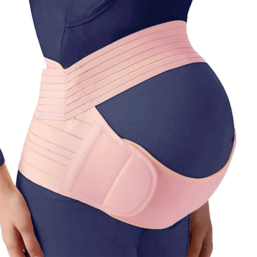 Una donna incinta che indossa una fascia di sostegno Una donna incinta che indossa una fascia di sostegno